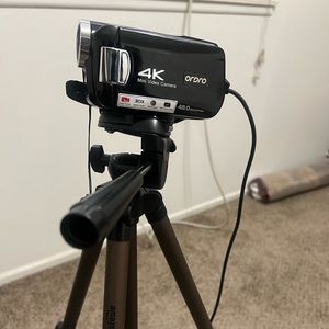 4K Video Camera with 64G SD card and two cords.